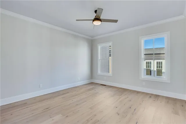 a bathroom with a toilet a sink and a window