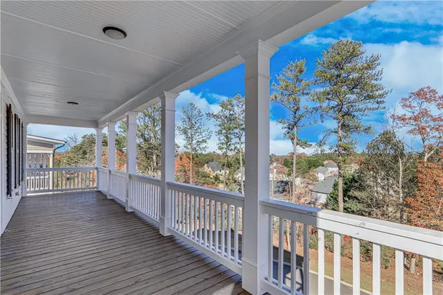 a view of a kitchen with a sink and a refrigerator
