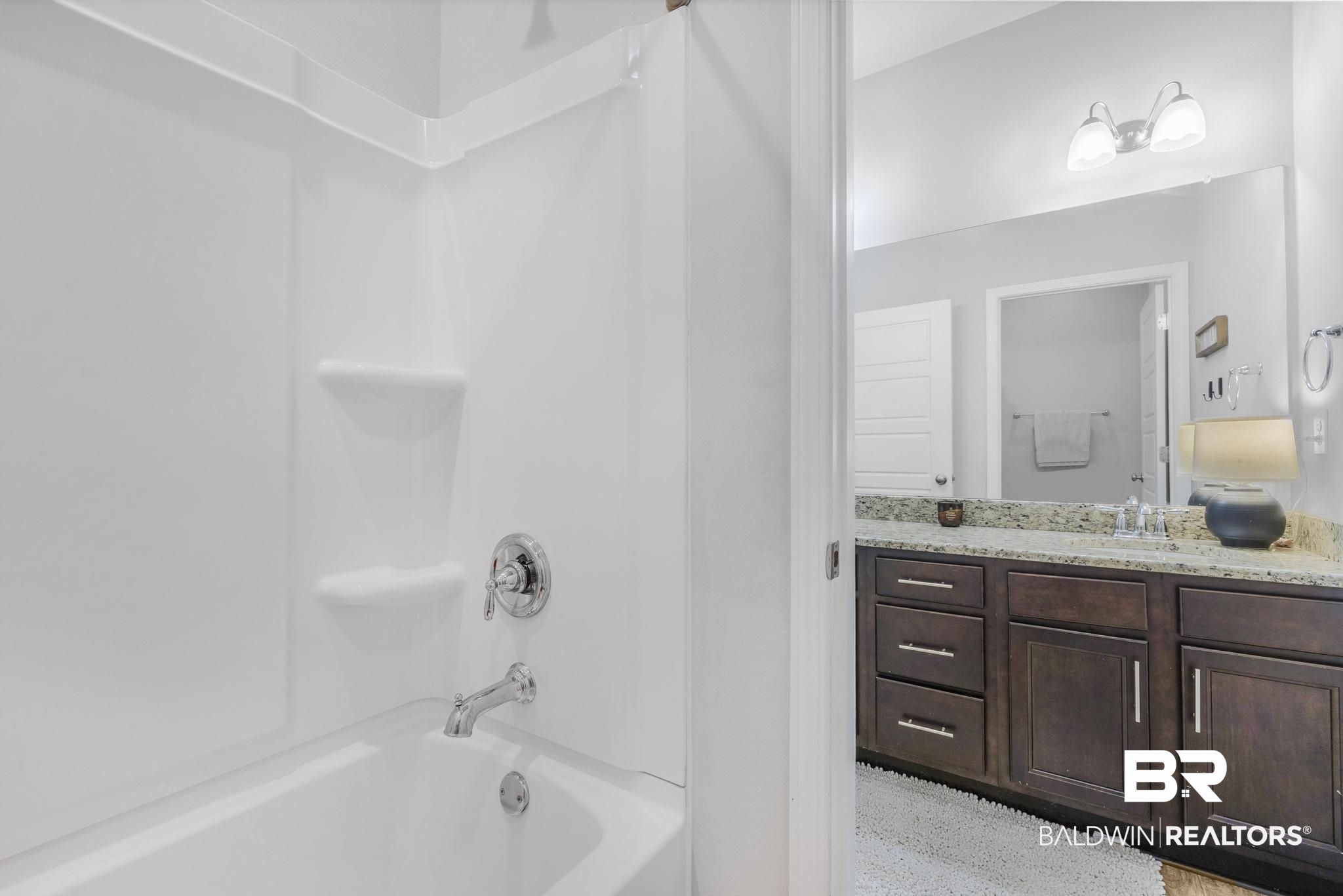 31336 Hoot Owl Road Daphne, AL 36527 - Photo 17 of 36 Bathroom featuring tub / shower combination and vanity
