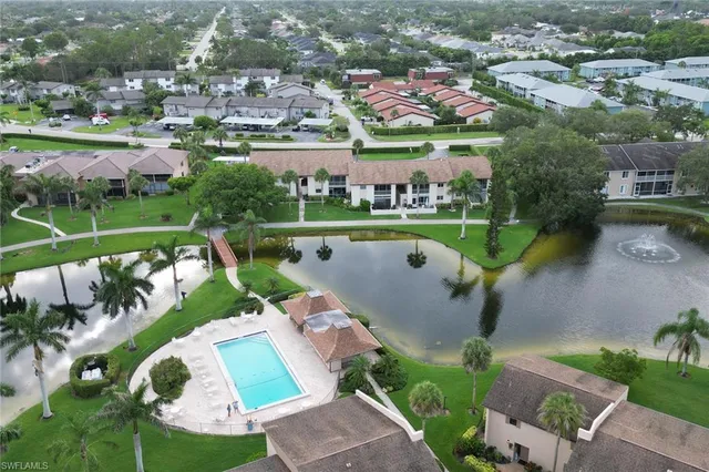 an aerial view of a house with a lake view