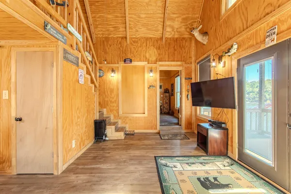 a living room with furniture and a flat screen tv