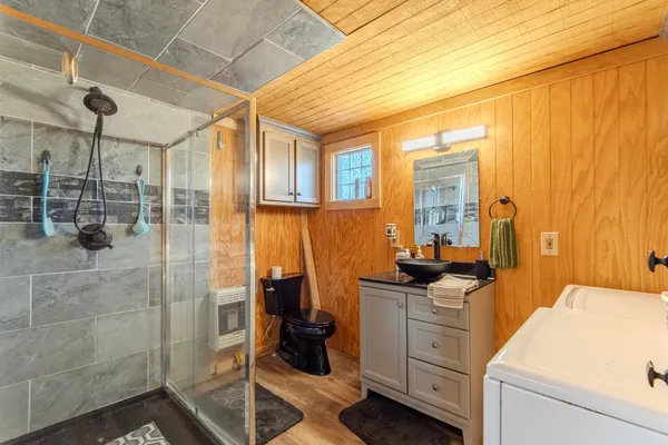 a view of a bathroom with a sink and mirror