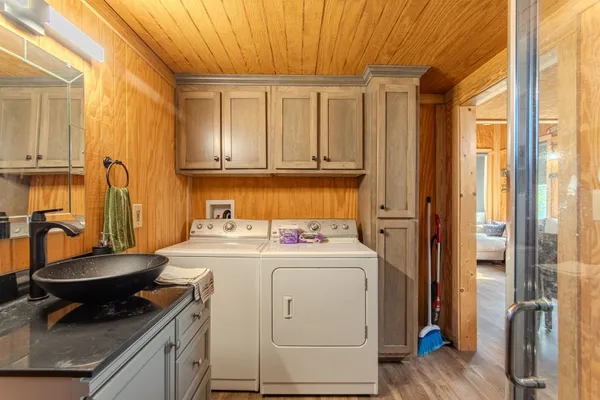 a kitchen with a stove a sink and a refrigerator
