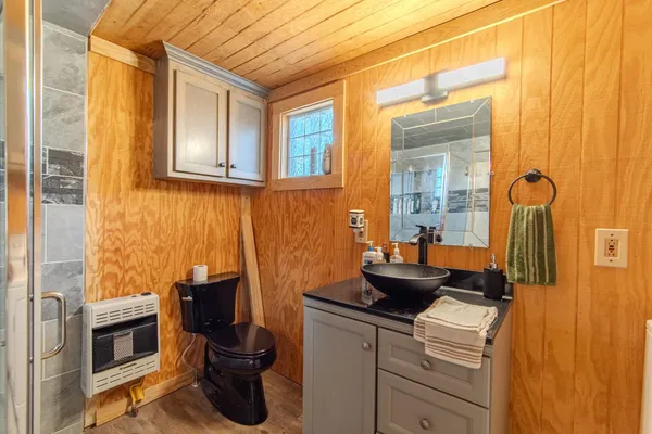 a kitchen with a refrigerator and a stove