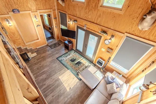 a view of a patio with wooden floor and iron stairs