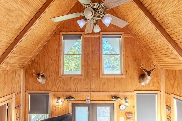 a front view of a house with a blue gate