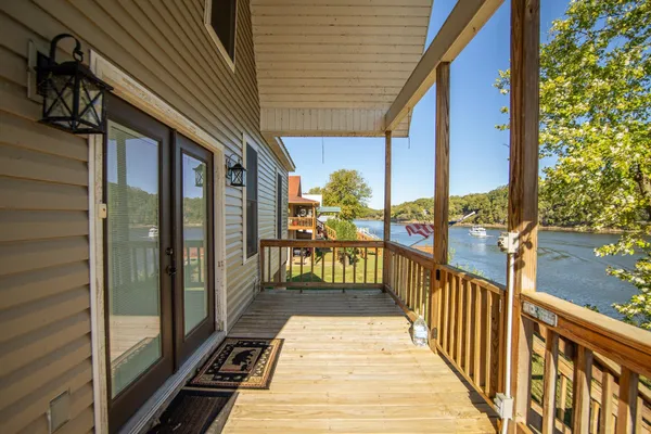 a view of a balcony with chairs