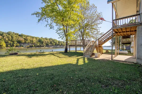 a view of a swimming pool with an outdoor space and seating area