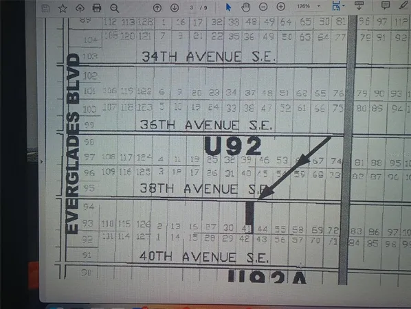 a view of a big house in front of a house with a road