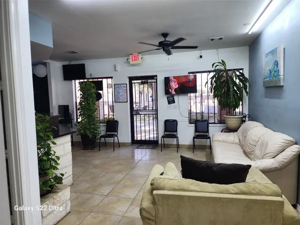 a living room with furniture and a large window