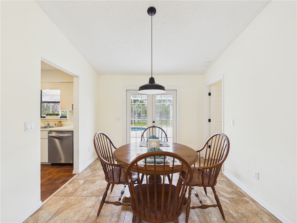 225 Midvale Terrace Sebastian, FL 32958 - Photo 8 of 25 a view of a dining room with furniture window and wooden floor