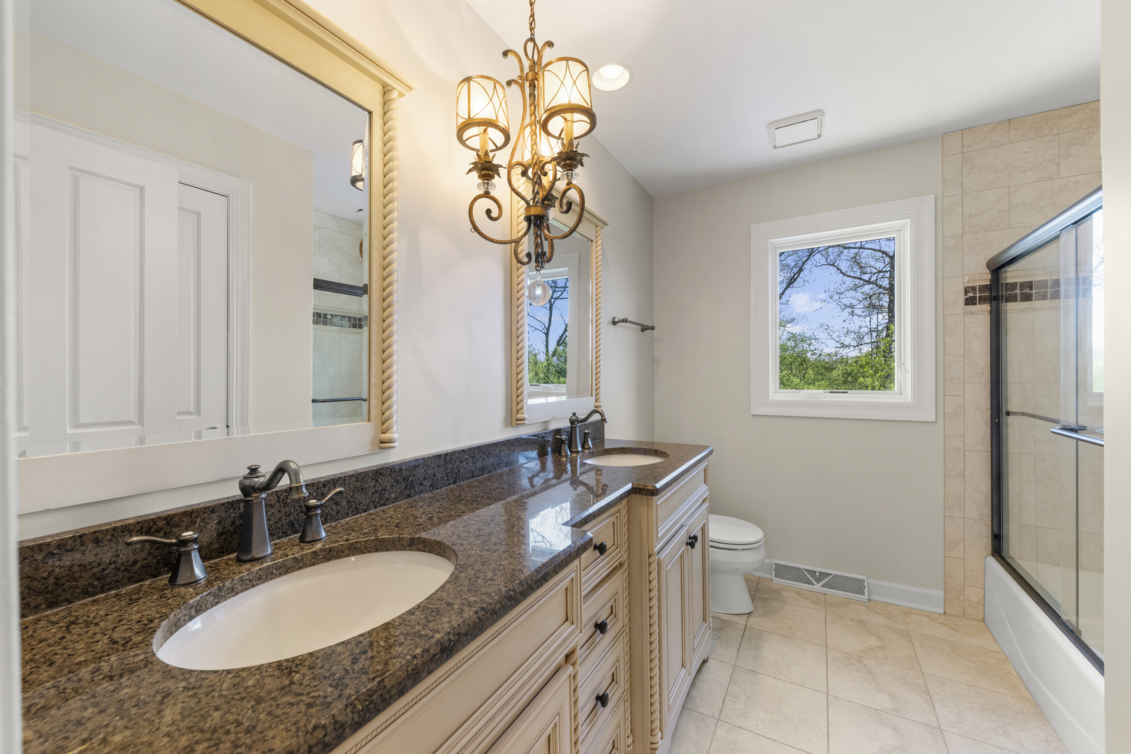 1S151 Winfield Road Wheaton, IL 60189 - Photo 41 of 73 a bathroom with a granite countertop sink a mirror and a shower