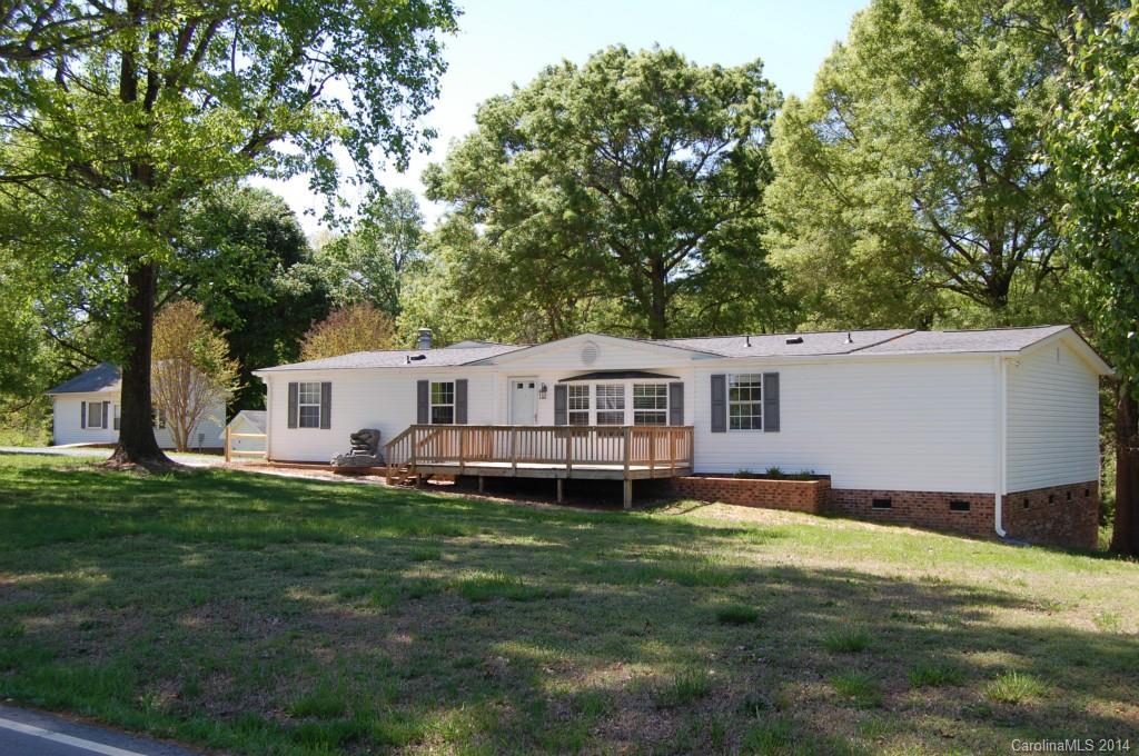 4015 Love Mill Road Monroe, NC 28110 - Photo 2 of 19 a front view of a house with a garden
