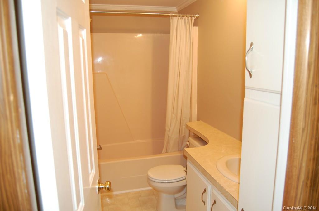 4015 Love Mill Road Monroe, NC 28110 - Photo 11 of 19 a bathroom with a granite countertop sink and a mirror