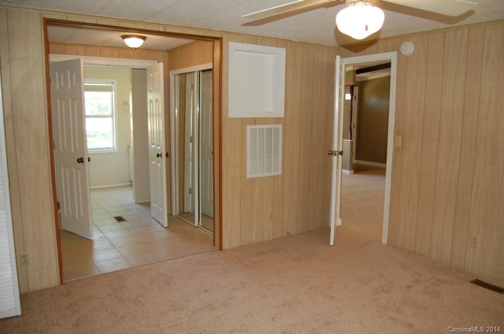 4015 Love Mill Road Monroe, NC 28110 - Photo 13 of 19 a view of a hallway with closet and a bathroom