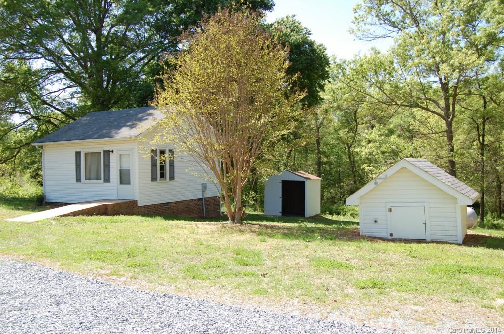 4015 Love Mill Road Monroe, NC 28110 - Photo 17 of 19 a house that has a tree in front of it