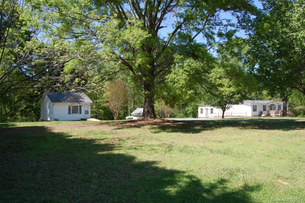 4015 Love Mill Road Monroe, NC 28110 - Photo 18 of 19 a view of a house with a yard and sitting area