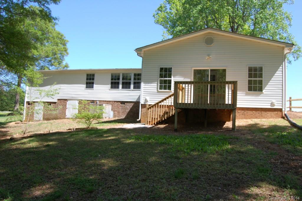 4015 Love Mill Road Monroe, NC 28110 - Photo 4 of 19 a front view of a house with a yard