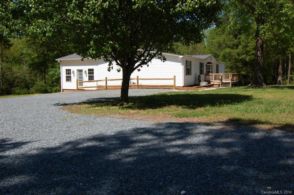 4015 Love Mill Road Monroe, NC 28110 - Photo 5 of 19 a front view of a house with garden