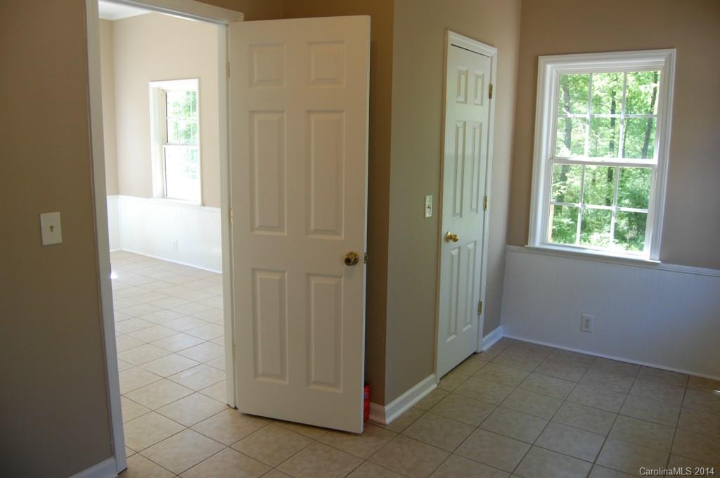 4015 Love Mill Road Monroe, NC 28110 - Photo 7 of 19 an empty room with windows and closet