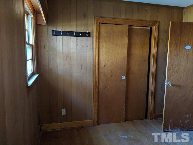 142 Evergreen Road Clarksville, VA 23927 - Photo 12 of 25 an empty room with wooden floor
