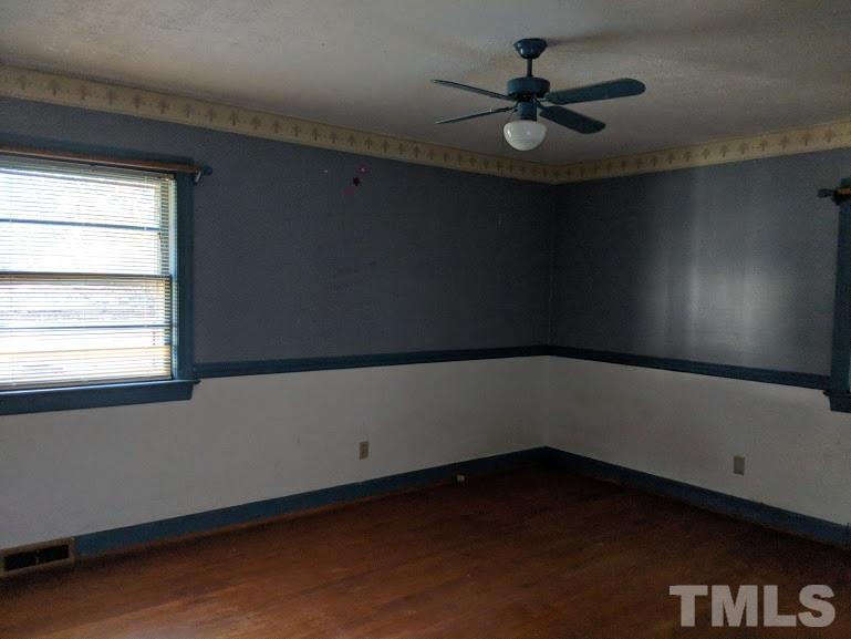 142 Evergreen Road Clarksville, VA 23927 - Photo 13 of 25 a view of a livingroom with a ceiling fan and window