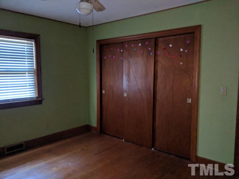 142 Evergreen Road Clarksville, VA 23927 - Photo 14 of 25 an empty room with a window and a chandelier fan