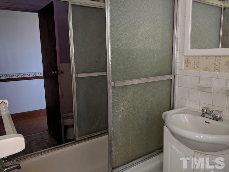 142 Evergreen Road Clarksville, VA 23927 - Photo 15 of 25 a bathroom with a sink and a toilet