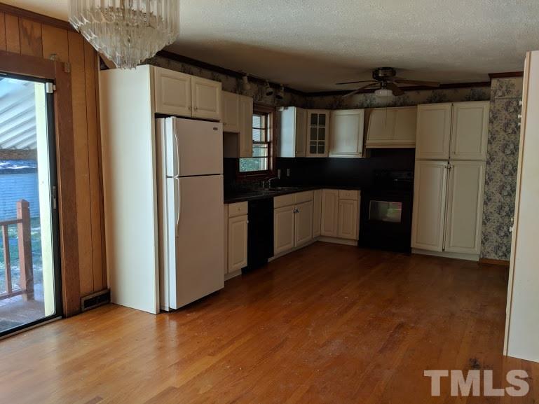 142 Evergreen Road Clarksville, VA 23927 - Photo 6 of 25 a kitchen with metallic refrigerator freezer and a dishwasher