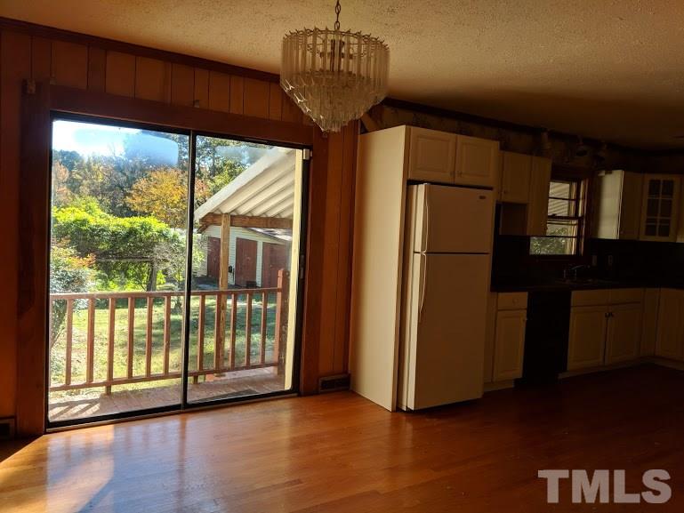 142 Evergreen Road Clarksville, VA 23927 - Photo 7 of 25 a view of a room with a large window and wooden floor
