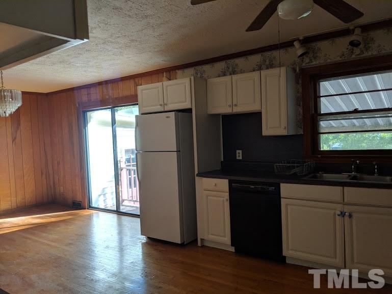 142 Evergreen Road Clarksville, VA 23927 - Photo 8 of 25 a kitchen with a refrigerator and a stove top oven