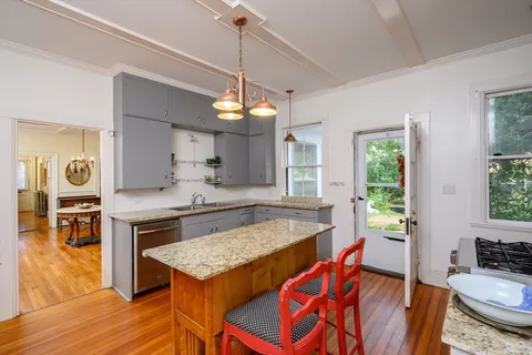 a kitchen with a table and chairs in it