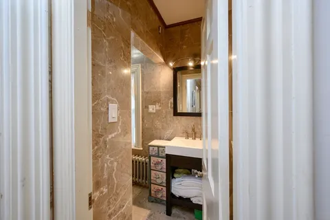 a bathroom with a sink and a mirror