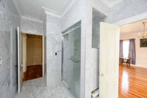 a view of a bathroom from a hallway