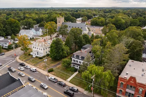 an aerial view of residential houses with outdoor space