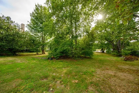 a view of outdoor space with deck and yard