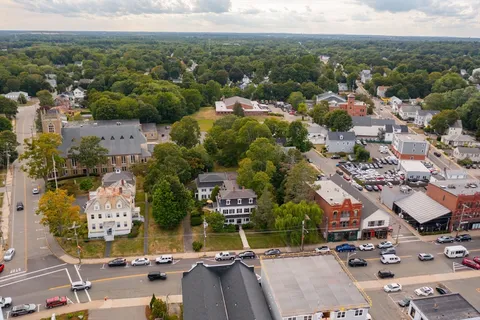 an aerial view of residential houses with outdoor space