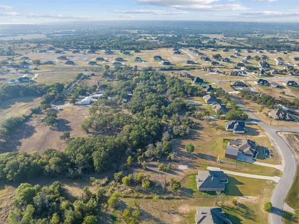 an aerial view of residential building and lake
