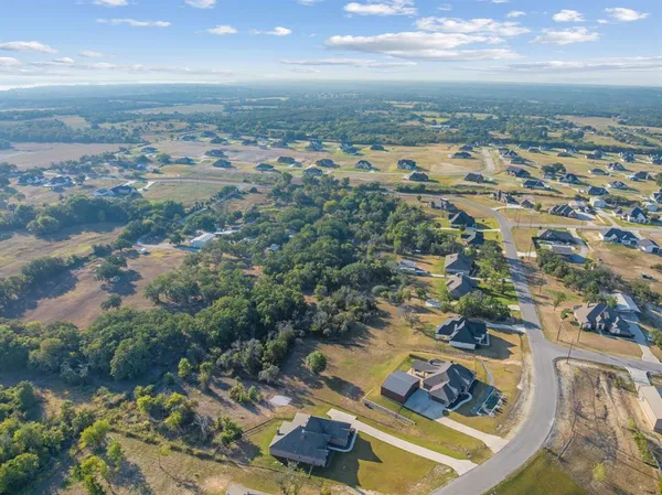 a view of a lake with a yard