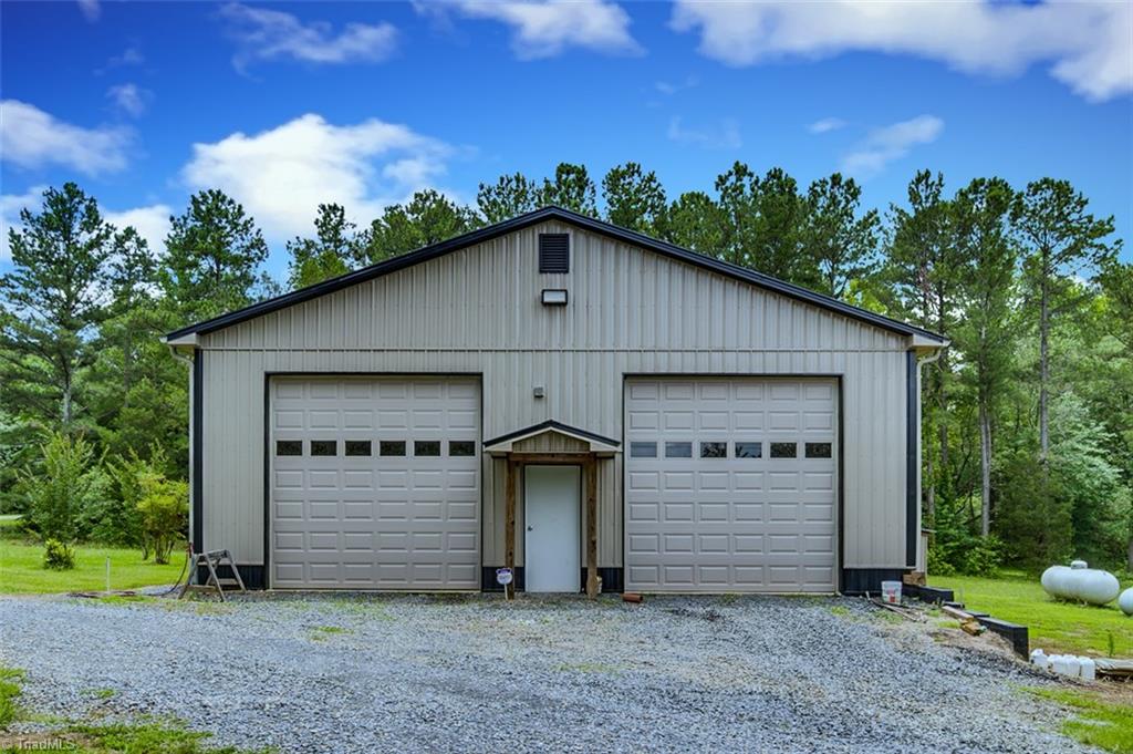 1204 Bescher Chapel Road Trinity, NC 27370 - Photo 24 of 27 50 x 40 Metal workshop garage with lift remaining and gas heater