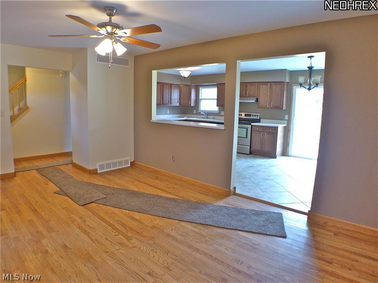 832 North Road Southeast Warren, OH 44484 - Photo 2 of 14 Living room with refinished hardwood flooring open to kitchen