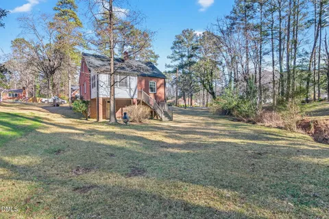 a view of a park with large trees