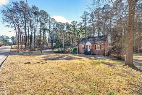 a house with trees in front of it