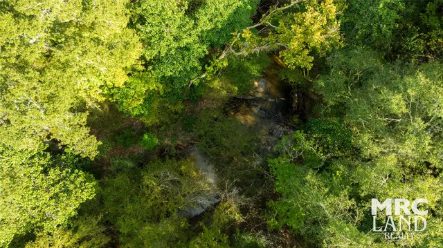 a view of a field with an outdoor space