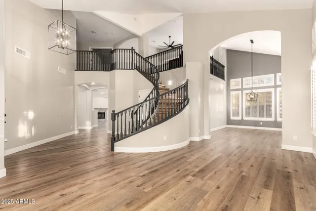 a large kitchen with a table and chairs