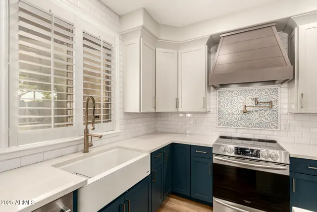 a spacious bathroom with a bathtub sink and mirror