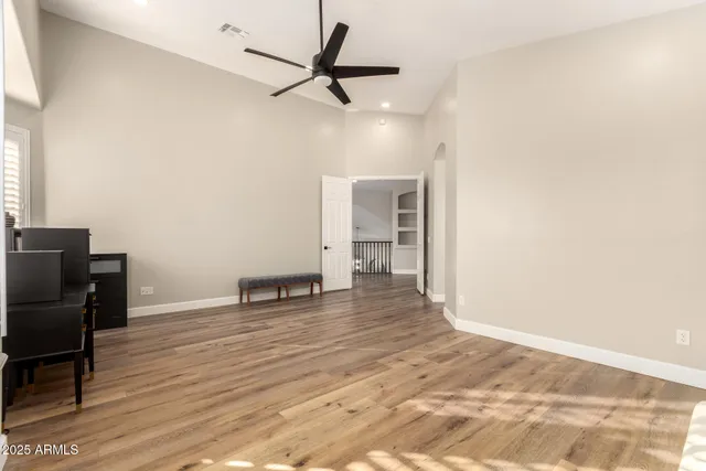 a bathroom with a toilet a sink and glass door