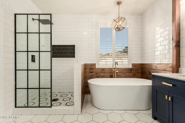 a bathroom with a toilet sink vanity and mirror