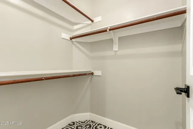 a view of a house with pool and sitting area