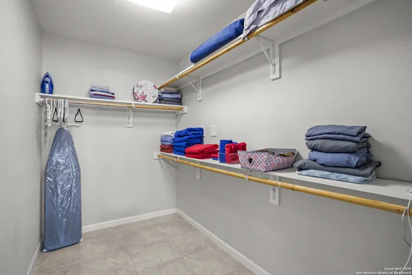 a utility room with sink dryer and washer